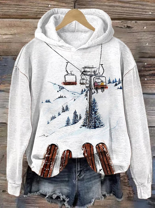 16. Montagne - Sweat-shirt à capuche décontracté à manches longues et imprimé ski pour femme